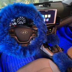 a blue furry car steering wheel cover