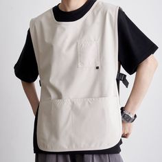 This apron not only serves as a protective garment to prevent dirt and stains but also comes with a range of practical features. It is made of waterproof material to shield your clothes from splashes and spills. The sleeveless design offers freedom of movement, and its reversible feature allows for versatile wearing options. The adjustable side straps provide a customizable fit. The comfortable round collar design adds an extra level of comfort, while the multiple pockets offer convenient storag Reversible Clothing, Work Vest, Restaurant Uniforms, Workwear Brands, Work Aprons, Shirt Design Inspiration, Vest Designs, Aprons Patterns, Style Japonais