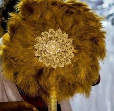 a person wearing a fur hat with beads on it