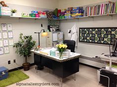 an office with desk, chair and bookshelf