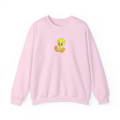 Indulge in the cozy, childhood-like joy with our Tweety Bird Looney Toons Sweatshirt! This charming unisex sweatshirt is the perfect blend of comfort and nostalgia, crafted from a soft and durable blend of 50% cotton and 50% polyester. Featuring medium-heavy fabric (8.0 oz/yd² or 271.25 g/m our sweatshirt provides warmth without feeling overly heavy, making it suitable for various seasons. With its loose fit design and ribbed knit collar, it offers a relaxed and stylish look while retaining its Cute Winter Sweatshirt With Character Print, Cute Winter Character Print Sweatshirt, Cute Long Sleeve Sweatshirt With Character Print, Playful Long Sleeve Sweatshirt With Character Print, Cute Crew Neck Sweater With Ribbed Cuffs, Cute Loungewear Tops With Ribbed Cuffs, Cute Ribbed Cuffs Tops For Loungewear, Cute Tops For Loungewear With Ribbed Cuffs, Cute Tops With Ribbed Cuffs For Loungewear