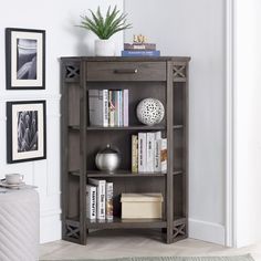 a book shelf with books on it in the corner of a room next to a door