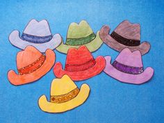 five different colored cowboy hats with sequins on them