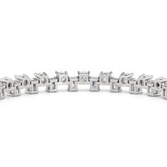 Fine jewelry with a bit of an attitude and bold flair. The classic tennis bracelet's silhouette gets an update with this piece's up-down gemstone arrangement. One row features emerald cut diamonds, while the other has round diamonds. Modern Diamond Bracelet With Baguette Cut Accents, Timeless Platinum Bracelets With Baguette Diamonds, Timeless Platinum Bracelet With Baguette Diamonds, Timeless Diamond White Tennis Bracelet With Baguette Cut, Modern Baguette Cut Diamond Bracelet With Accents, Timeless Silver Diamond Bracelet With Emerald Cut, Silver Emerald Cut Diamond Bracelet Timeless, Timeless Silver Emerald-cut Diamond Bracelet, Modern Baguette Cut Diamond Bracelet For Anniversary