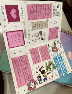 an open notebook with stickers and writing on the pages is sitting on a table