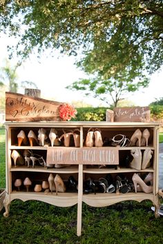 a wooden cabinet with shoes on it and a sign that says, we are married