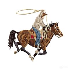 a cowboy riding a horse with a lasso on his back and rope hanging from it's neck