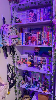 a book shelf filled with lots of books next to a wall covered in purple lights