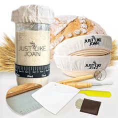 bread, flour, measuring tape, and other items are arranged on a white surface