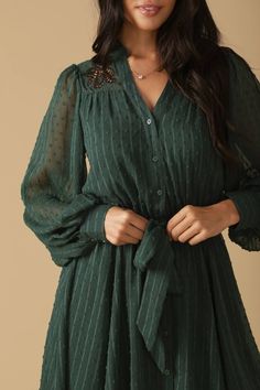 A textured woven mini dress featuring V neckline, embroidered yoke, long sleeve, elasticized waist with self sash belt and button down Details: Self : 100% PolyesterLining : 100% Polyester Size & Fit - Model is 5`8" And Wearing Size Small- Measurements Taken From Size Small- Approx. Length: 35" Green Long Sleeve Belted Mini Dress, Champagne Gold Dress, What To Wear Fall, Bachelorette Party Dress, Rehearsal Dinner Dresses, Rehearsal Dress, Green Bridesmaid Dresses, Maxi Dress Wedding, Floor Length Gown