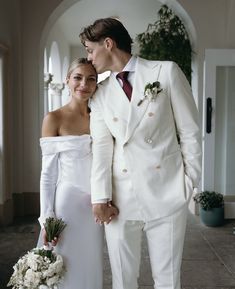 a bride and groom posing for a photo