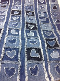 an old piece of denim with hearts drawn on it