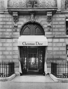 the entrance to christian dior is shown in black and white