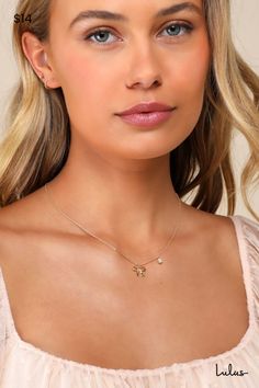 Include the Lulus Sweet Addition Gold Bow Rhinestone Chain Necklace in any of your favorite 'fits for a too-chic finish! This darling lil' necklace is composed of shiny gold-toned metal that shapes an ultra-slender chain with a darling bow charm that sits at the center. A petite rhinestone detail at the side lends a hint of sparkle to this cute design. Lobster Clasp Closure. Chain Measures 15. 25" Long With A 2" Extender Chain. 90% Brass, 10% Cubic Zirconia. Imported. Lulus | Sweet Addition Gold Dainty Party Necklace With Diamond Accents, Dainty Necklace With Diamond Accents For Party, Dainty Diamond Accent Necklace For Parties, Gold Plated Clavicle Chain Charm Necklace For Party, Gold Plated Collarbone Chain Necklace For Party, Party Gold Diamond Necklace With Delicate Chain, Rose Gold Charm Necklace With Delicate Chain For Party, Party Rose Gold Charm Necklace With Delicate Chain, Feminine Gold Charm Necklace With Delicate Chain