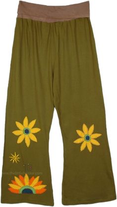 A funky pair of pants in soft cotton sinker fabric with beautiful sun or sunflower handmade motifs embroidered.  These cotton pants feature a flexible and comfortable yoga waist, they drape in a slight bell-bottom style. #tlb #SplitSkirtsPants #Embroidered #bohemianfashion #Handmade #BohemianPants Cotton Hippie Wide Leg Yoga Pants, Hippie Wide-leg Cotton Yoga Pants, Hippie Wide Leg Cotton Yoga Pants, Cotton Flare Pants For Festivals, Festival Flare Cotton Pants, Cotton Hippie Yoga Pants, Hippie Cotton Yoga Pants, Hippie Cotton Yoga Pants With Relaxed Fit, Embroidered Cotton Harem Pants For Spring