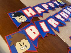 the birthday banner is decorated with paper cut outs