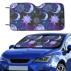 a blue car with stars and moon designs on it's front windshield, next to an image of the sun and moon