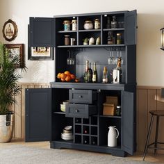 a black cabinet filled with lots of bottles and glasses