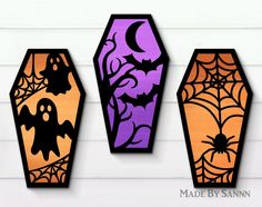 three halloween vases with decorations on them