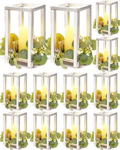 twelve candles with green leaves and white flowers in glass cubes, set of eight