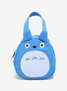 a blue totoro shaped purse with eyes