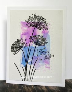 a card with watercolor flowers on it