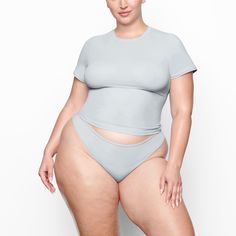 Fits Everybody T-shirt | Sky — The essential everyday fitted t-shirt: with a crew neck fit and buttery soft feel, this body-hugging tee is perfect to wear alone or layered under other pieces. Solid Seamless T-shirt For Athleisure, Seamless Short Sleeve T-shirt For Loungewear, Seamless Second-skin Top For Loungewear, High Stretch Seamless T-shirt, Seamless Second-skin Crew Neck Top, Stretch Smoothing Tops For Loungewear, Seamless Second-skin Tops For Loungewear, Seamless High Stretch Scoop Neck T-shirt, Seamless High-stretch Scoop Neck T-shirt