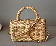 Vintage, Wicker, Women's Bag  with  gilded  strap in very   good condition! Retro hand made Wicker back! Lovely vintage find!  Take a good look at the photos, they are part of the description! ►Dimensions: 9/9 inches ►Period: Around 1970 ►Styles: Vintage ►Place of Origin: West Europe  ►Materials: Vinyl, Wicker, Metal ►Condition: Very Good  ►Condition Notes: Very Good item - N. 983/e Gold Rectangular Bag With Brass Hardware, Gold Bags With Brass Hardware, Rectangular Shape, Gold Rectangular Bags With Brass Hardware, Traditional Gold Shoulder Bag For Travel, Vintage Gold Bag For Travel, Vintage Gold Travel Bag, Vintage Gold Top Handle Shoulder Bag, Vintage Gold Shoulder Bag For Everyday Use, Gold Rectangular Woven Shoulder Bag