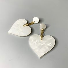 These heart pendant earrings are a level of chic flirty that even we weren't sure we could achieve. But here we are, living for every minute of it. 3.75" Acrylic, gold plated Made in Brooklyn, NY Heart Crystal, White Earrings, Spring Looks, Pendant Earrings, Crystal Earrings, Heart Pendant, Brooklyn, Gold Plate, Plating