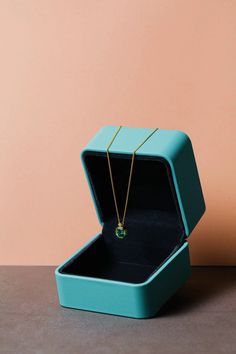 Experience luxury with our top-quality Colombian Emerald Necklace, complete with a GRC certificate for authenticity. Key Features: Main Gemstone: 1.2 CT Lab-Created Colombian Emerald (6*7 mm) Side Gemstone: 2.25 mm Natural Zircon Chain Material: S925 Silver Plated with 18K Yellow Gold Chain Length: 38cm Crafted to perfection, this necklace showcases a 1.2 CT lab-created Colombian emerald measuring 6*7 mm, certified by GRC for quality and authenticity. The addition of 2.25 mm natural zircon accentuates its beauty. The chain, made of S925 silver and adorned with 18K yellow gold plating, adds a touch of elegance to this exquisite piece. Elevate any occasion with the allure of our Colombian Emerald Necklace, a testament to sophistication and luxury." Pairing earrings link:https://www.etsy.com/ Modern Jewelry With Vs Clarity As A Gift, Modern Jewelry Gift With Vs Clarity, Modern Jewelry Gifts With Vs Clarity, Modern Jewelry As A Gift With Vs Clarity, Luxury Emerald Birthstone Necklace Gift, Luxury Emerald Birthstone Necklace For Gift, Luxury Gold Emerald Necklace As A Gift, Modern Jewelry With Gift Box, Rectangular Yellow Gold Emerald Necklace Gift