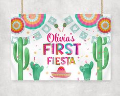 a sign hanging on the wall that says fiesta's first fiesta with cactus and sombrero