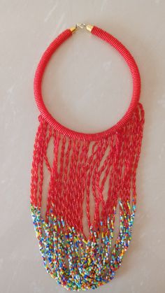 African Fringe Necklace, African Beaded Jewelry, Red Beaded Necklace, Tribal Jewelry, Women Necklaces, Mothers Gift, Chunky Jewelry This multi strand necklace is superbly crafted which makes you out stand in any occasion. Main Color - Red. Different colors are available. Feel free to send me a convo or e-mail for any clarification or more information. Thank you for visiting, Red Beaded Bracelet With Tiny Beads For Parties, Red Beaded Bracelets With Tiny Beads For Party, Red Tiny Beaded Bracelets For Party, Red Polished Beads Beaded Necklace For Festival, Red Bohemian Beads With Beaded Chain, Traditional Red Beaded Bracelets With Large Beads, Red Beaded Chain For Festivals, Red Beaded Choker For Party, Red Bohemian Beaded Chain Beads