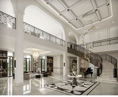 a large open floor plan with stairs and chandelier