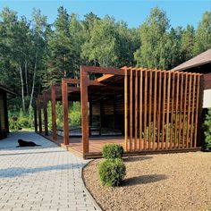 a wooden structure sitting in the middle of a park