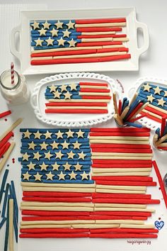 an american flag made out of popsicle sticks and toothpicks on a tray