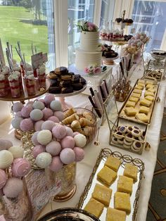 an assortment of desserts and pastries on a table