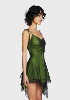 cuz the world needs your light. This mini dress has a stretchy jersey construction with a sheer mesh overlay, adjustable shoulder ties, ruching at the bust, and an asymmetrical handkerchief hem. Green Mesh Dress, Little Green Dress, Spring Evening Ruched Mesh Dress, Sheer Polyamide Summer Dress, Sheer Summer Dress Made Of Polyamide, Spring Night Out Polyamide Dress, Summer Party Mini Dress With Ruched Back, Summer Mini Dress With Ruched Sides, Summer Stretch Nylon Dresses