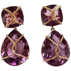 18kt Yellow Gold Drop Earring with gold wrapped faceted cushion shaped Purple Amethyst top and faceted pear-shaped Purple Amethyst.  This elegant earring measures an inch and a half long.  The top cushion is shaped Amethyst that measures half an inch wide. The faceted pear-shaped Amethyst drop measures an inch and an eighth wide.  Can be pierced or clip.  Additionally, these earrings can be made with any stone combination and color gold. Please let me know if you have any questions. Best, Christ Cushion Cut Earrings, Sand Dollar Earrings, Yellow Gold Drop Earrings, Gold Wrap, Cushion Cut Ring, Yellow Gold Earrings, Pink Topaz, Fine Jewelry Collection, Drop Earring