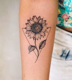 a sunflower tattoo on the arm with an instagramr above it and below