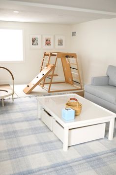 the living room is clean and ready to be used for play time, as well as other things