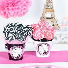 pink and black lollipops in buckets with eiffel tower decoration