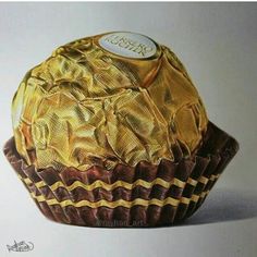 a drawing of a chocolate cupcake with icing on the top and gold foil covering it