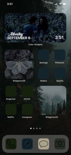 an iphone screen with different images and text on the bottom right corner, below which is a dark forest scene