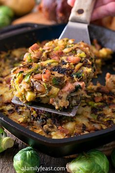 a pan filled with food and a spatula on top of the casserole