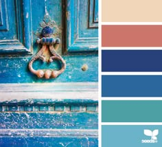 a blue door with an ornate handle on it and the color scheme in shades of teal