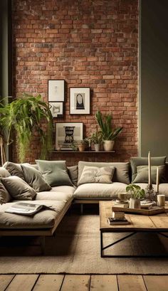 a living room filled with lots of furniture next to a brick wall and potted plants