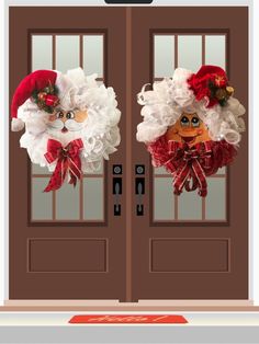 two christmas wreaths hanging on the front doors of a house with santa claus's head