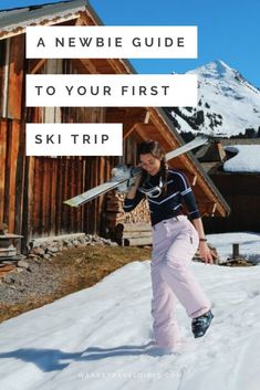 a woman walking in the snow with skis on her back and text overlay that reads a newbie guide to your first ski trip