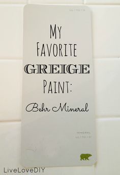 a white tile wall with the words my favorite greige paint written on it