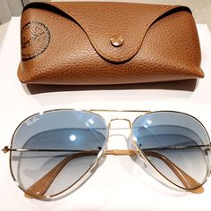 Original Ray-Ban Sunglasses 2 Shades, Used Once Looks Brand New. Lenses: Light Blue Gradient, Frame: Gold Blue Aviator Sunglasses With Tinted Lenses, Blue Gradient Aviator Sunglasses With Glass Lenses, Light Blue Gradient, Blue Gradient, Ray Ban Sunglasses, Blue Gold, Ray Ban, Sunglasses Accessories, Ray Bans